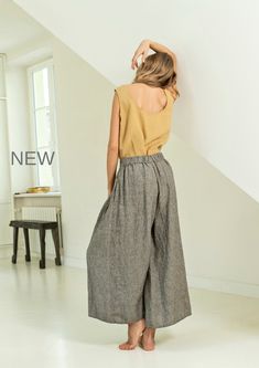 "Linen culotte pants with extra wide bottom. These culottes combine elegance of the skirt and comfort of the pants. Darts around the waist create an optically thinner waistline. These flowy culottes are perfect for work as well as leisure. You will always stand out and feel super stylish wearing them. Double washed for extra softness and shrinkage prevention. ABOUT US LINEN ID was born from desire to embrace things that actually matter. We aim to create sustainable garments that offer uncompromi Relaxed Fit Linen Wide-leg Culottes, Relaxed Fit Linen Culottes With Wide Legs, Relaxed Fit Linen Wide Leg Culottes, Summer Wide Leg Flax Colored Pants, Spring Linen Wide Leg Culottes, Summer Linen Culottes With Relaxed Fit, Chic Linen Wide Leg Culottes, Spring Wide Leg Linen Culottes, Relaxed Fit Linen Ankle-length Culottes