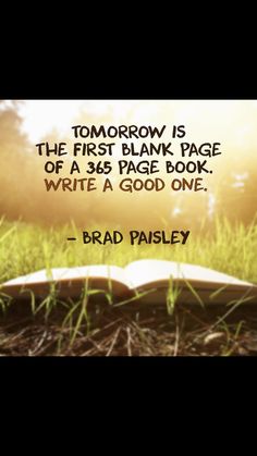 an open book sitting in the grass with a quote on it that reads, tomorrow is the first blank page of a 35 page book write a good one