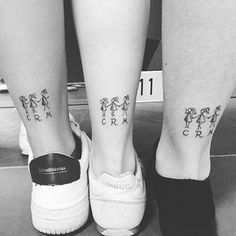 two people's legs with tattoos on them and the words crm written in small letters