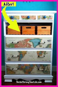 a white dresser with drawers and maps on it