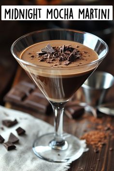 a martini glass filled with chocolate and garnished with cocoa