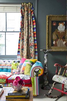 a living room filled with furniture next to a window