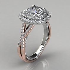 a gold and white engagement ring with diamonds