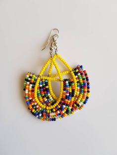 This listing is for ALL 9 pairs. The earrings are 100% handmade using original fine beads. Colorful and bright colors. ^^These earrings ships through dhl express. Buy multiple items and pay shipping for ONE item ONLY. Handmade Bohemian Multicolor Wrap Earrings, Handmade Yellow Drop Hoop Earrings, Festival Jewelry With Round Beads And Ear Wire, Multicolor Round Bead Earrings For Gifts, Adjustable Multicolor Wrap Earrings With Ear Wire, Multicolor Teardrop Hoop Earrings With Dangling Beads, Yellow Round Earrings For Festivals, Multicolor Drop Wrap Earrings, Multicolor Single Dangle Earring