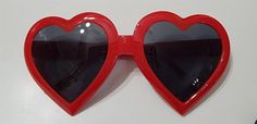 Fun Red Heart-shaped Sunglasses, Red Heart-shaped Sunglasses For Valentine's Day, Red Plastic Sunglasses For Valentine's Day, Heart-shaped Sunglasses For Valentine's Day, Fun Red Sunglasses For Valentine's Day, Red Heart-shaped Tinted Sunglasses, Red Tinted Sunglasses As A Gift, Red Tinted Lenses Sunglasses As Gift, Valentine's Day Gift Sunglasses With Tinted Lenses