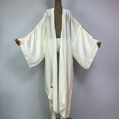 One Size fits S-3X/4X Kimono length: 58inch Material: Poly Silk (a lightweight, smooth, and shiny fabric that drapes and flows very well. An affordable alternative to silk) One Size Fits Most Size Chart Long Silk Flowy Kimono, White Long Kimono One Size, Long White One-size Kimono, White Long One-size Kimono, White Long Silk Kimono, White Flowy Long Kimono, White Oversized Long Kimono, Oversized Long White Kimono, Elegant Oversized Open Front Kimono