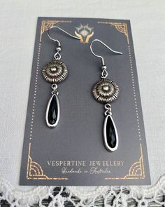 Vintage style silver earring with a black Swarovski drop. These are a smaller sized earring, and light weight to wear. The silver round pendant part is made in USA, it measures 13 mm round. I have teamed this with a Swarovski teardrop shape drop which is set into a silver rhodium plated setting. The total drop of this earring, measured from the top of the stainless steel earring hook is 60mm or 2 ½ inches. Hooks can be changed at checkout if you prefer a different style, they are all stainless steel. ♥︎ SILVER COMPONENTS  The Silver components in the jewellery are a brass base that are plated in a rich antique oxidised patina, they are made in USA and are excellent quality.  The plating is a professional process which reduces oxidation and ensures timeless beauty and durability. These Fila Birthday Best Friend, Black Earring, Victorian Vintage, Earring Hook, Necklace Clasps, Gift For Her Birthday, Wedding Jewellery, Silver Plated Jewelry, Best Friend Gift