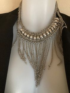 Adjustable. Very Nice. Priced to sale. Elegant Metal Bib Necklace With Chain Detail, Elegant Metal Bib Necklace With Chain, Chic Multi-strand Silver Necklaces, Chic Silver Multi-strand Necklaces, Metal Beaded Chain Necklace For Party, Metal Chain Bib Necklaces, Beaded Metal Chain Necklace For Party, Metal Bib Necklace With Chain, Metal Bib Necklaces With Chain