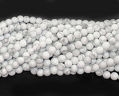 white marble beads are stacked on top of each other