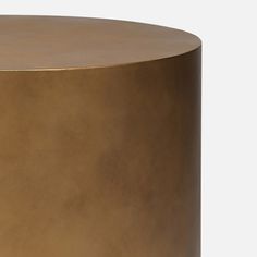 a round table with gold colored paint on it