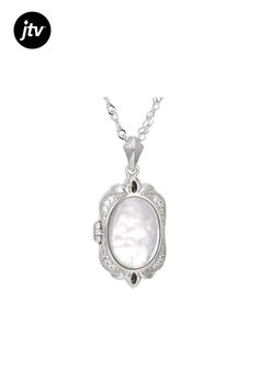 White Mother-of-Pearl Doublet with 0.08ctw White Zircon Rhodium Over Sterling Silver Locket Pendant w/Chain. Pendant measures approximately 1 1/8" L x 5/8" W and has a 1.5mm bail. Singapore chain measures approximately 18 inches in length, 1/32 of an inch in width with a lobster claw clasp closure and a 2-inch extender. Colors, shapes, and sizes may vary. Accent stones primarily zircon. Formal Mother Of Pearl Jewelry With Pearl Charm, Elegant Locket Jewelry For Anniversary, Elegant Necklace With Polished Finish For Keepsake, White Oval Pendant With Polished Finish, Anniversary Mother Of Pearl Jewelry With Pearl Chain, Elegant Silver Locket Necklace, Elegant Oval Pendant Keepsake Jewelry, Classic Locket Jewelry For Wedding, Classic White Oval Pendant Jewelry