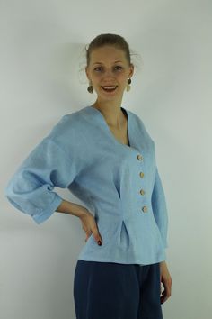 "Write the selected color in the message Handmade sky blue V neck linen blouse with front buttons and long sleeves, perfect for casual wear and suitable for any occasion in any season Details: - 100% natural linen produced in Europe ; - medium weight (180 gram per square meter); - color: sky blue, could be any from our colors catalog (color samples at the photo); Made to order, approximately a few days, If you have any questions please message me and I will be glad to answer. Size guide : Size X Linen Apron Pinafore, Color Catalog, Summer Linen Dresses, Linen Casual, Summer Linen, Blue V, Linen Blouse, Wrap Blouse, Green Blouse