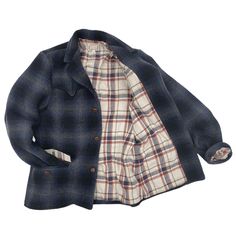 SPECS Shell: Heavy 21.25 Oz. soft-hand wool fabric, shadow plaid with dominant black/blue/grey. Milled in Japan.Lining: 100% cotton woven plaid heavy flannel, natural/navy/red dominant. Milled in Japan. * An original pattern inspired by vintage westernwear jackets designed for the 1950s-60s urban cowboy.* Deconstructed silhouette.* High lapel roll.* Western arcuate yoke on front/back top block.* Swing-back expansion pleats construction.* Scalloped pocket flaps with plaid flannel facing accents.* Plaid Wool Outerwear For Cold Weather, Winter Plaid Sport Coat With Welt Pockets, Plaid Sport Coat With Welt Pockets For Fall, Plaid Wool Single-breasted Outerwear, Casual Plaid Wool Blazer, Plaid Wool Sport Coat For Fall, Plaid Wool Tweed Jacket With Pockets, Casual Plaid Sport Coat For Fall, Woodsman Style