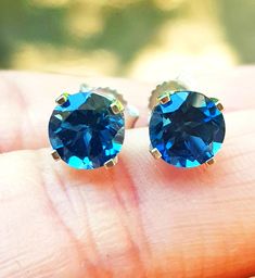 Make a statement with these sparkling and shimmery London Blue Topaz stud earrings. 💎 . Perfect for the bride  👰 . A wonderful gift for a loved one for any occasion.💝 . London Blue Topaz 💎 is the birthstone for December  GEMSTONE DETAILS: BRAND NEW Natural London Blue Topaz Round Cut Total of 1.30CT London Blue Topaz Stones - 6.0 mm Diameter each Total of 2.00CT London Blue Topaz Stones - 6.8 mm Diameter each CLARITY: VS COLOUR: Medium Blue TREATMENTS: Heated WEIGHT: 1.0-1.5 grams  JEWELLERY Blue Fine Jewelry Earrings For Wedding, Blue Sapphire Earrings For Anniversary, Blue Birthstone Earrings For Formal Occasions, Formal Blue Birthstone Earrings, Blue Topaz Earrings With Brilliant Cut As A Gift, Blue Cubic Zirconia Earrings With Brilliant Cut, Blue Fine Jewelry Earrings For Anniversary, Blue Topaz Round Earrings For Anniversary, Sapphire Brilliant Cut Earrings For Wedding