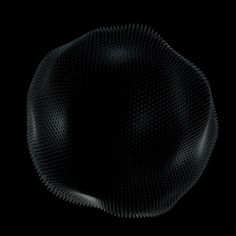 an abstract black and white image of a circular object in the dark, with no background