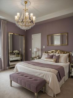 a bedroom with a large bed and a chandelier