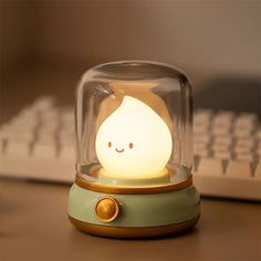 a cute little light sitting on top of a desk