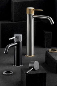 the modern faucet is placed next to other items on black and white background