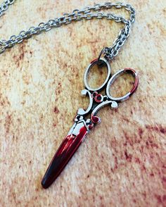 "Bloodstained scissors necklace. Non-toxic materials. The pendant is 2 1/2\" long and comes with a 24\" antiqued silver plated chain with a lobster clasp closure. Scissors do not open or cut. Perfect gift for a horror fan. I also have these scissors in bronze! www.etsy.com/TheDorkyVampire/listing/951215049/ Ships via First Class Mail. Need faster-upgraded shipping? Priority Mail shipping options are available during checkout! As always, your health and well-being are very important to us. Your o Horror Movie Jewelry, Horror Jewelry, Horror Necklace, Spoon Bending, Meat Art, Toko Fukawa, Scissors Art, Scissor Necklace