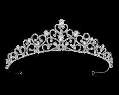 Silver Plated Crystal Wedding Tiara This captivating 1 1/2" tall tiara will provide a regal touch to your wedding day or quinceanera. Plated in classic silver , its beautiful scroll design is accented with sparkling teardrop crystal rhinestones. Color: Silver.Style: hp56207.Size: 1 1/2" tall.Delivery estimate is 10 days.Shipping Policy.Return Policy Flower Girl Dress Shoes, Prom Tiaras, Crystal Wedding Tiaras, Rose Gold Tiara, Silver Tiara, Gold Tiara, Rhinestone Tiara, Bridal Hair Jewelry, Rhinestone Wedding