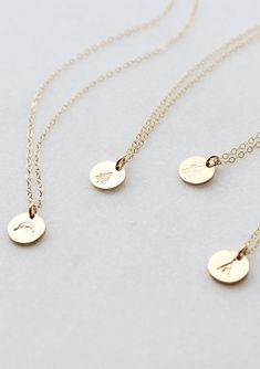 Our sweet, tiny dot stamped with one of our little symbol stamps. A solid 9mm disc is hand-stamped and attached to a delicate 18” chain. Different chain length can be requested using 'Notes' at checkout. Available in Sterling Silver and 14kt Gold Fill. Handmade in Eau Claire, WI. All of our jewelry is handmade to order just for you so each piece will be unique and may vary slightly from what is pictured. Due to its handmade nature, please allow 3-5 business days for orders to ship.