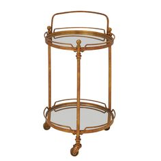 a gold metal and glass serving cart with wheels