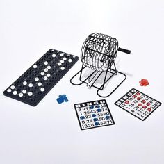 a black and white board game set with pieces on the ground, including a birdcage