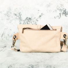 This Beige Leather Fanny Pack is the ideal bag if you like carrying all your necessities, keep your hands free and look effortlessly fashionable at the same time! Perfect for festivals, markets and travelling. Simple and beautiful bag made of a high quality Italian leather, which is soft to touch, strong, durable and a very fine material. Top grade thicker leather is used for the adjustable belt. This hip bag features one separate compartment closed by a zipper in the back and another zippered p Multifunctional Crossbody Bags For On-the-go, Trendy Travel Belt Bag Shaped Like A Tote, Beige Crossbody Belt Bag For On-the-go, Chic Chest Bag With Removable Pouch For On-the-go, Multifunctional On-the-go Pouch Bag, Everyday Crossbody Chest Bag With Cell Phone Pocket, Chest Bag With Cell Phone Pocket For Everyday Use, Everyday Chest Bag With Detachable Strap, Multifunctional Crossbody Shoulder Bag With Cell Phone Pocket