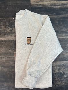 Calling all coffee lovers! If you like your coffee iced, this is the perfect sweater for you. This iced coffee design is stunning and beautifully stitched onto this cozy oatmeal heather crewneck sweatshirt. I strongly advise to view the sizing chart for your perfect fit. Fit is true to size. For an oversized look, consider sizing up. WANT YOUR CRENECK IN A DIFFERENT COLOR?! MESSAGE ME TO SEE WHAT I HAVE IN STOCK. :) *50% Cotton, 50% Polyester *Made with sustainably sources USA grown cotton *Seam Coffee Please Monogram Sweater Shirt, Custom Crewneck Sweatshirts, Galentines Gifts, Pumpkin Spice Shirt, Perfect Sweater, Coffee Sweatshirt, Lover Sweatshirt, Embroidered Crewneck, On The Rocks