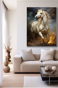 a living room with a couch, coffee table and large white horse painting on the wall