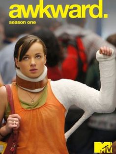 a woman in an orange shirt is holding her arm up with the words awkward on it