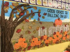 a bulletin board is decorated with fall leaves and pumpkins, along with the words god's grace is falling on us