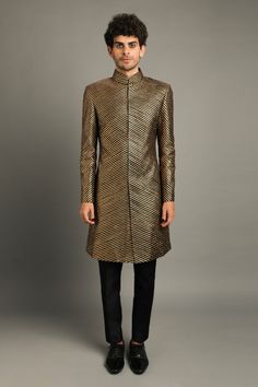 Black raw silk sherwani with gota embroidery all over. Comes with pant.
Component: 2
Pattern: Embroidery
Type Of Work: Gota
Neckline: Mandarin Collar
Sleeve Type: Long sleeves
Fabric: Raw Silk
Color: Black
Other Details: 
Antique gold gota
Occasion: Sangeet - Aza Fashions Ceremonial Bandhgala With Gota Work For Diwali, Elegant Festive Sherwani With Gota Work, Festive Raw Silk Sherwani With Gota Work, Elegant Festive Bandhgala With Gota Work, Transitional Festive Bandhgala With Gold Embroidery, Designer Traditional Wear With Gota Work, Designer Sets With Gota Work For Eid, Festive Sherwani With Gota Work For Reception, Formal Sherwani With Gota Work For Diwali