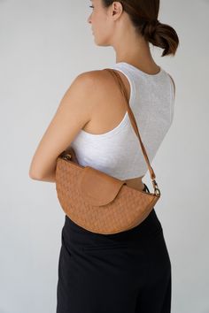 "Our first-ever purse, the Naomi Bag is iconic, versatile and timeless - just like the catwalk queen herself. Made for the moments you're looking to go a little more glam, pair her with anything in your closet to level-up your look from morning to night.  Check out our other products from our shop below:  https://www.etsy.com/shop/MANDRNdesign PRODUCT FEATURES:  - 100% genuine leather  - Handwoven by independent artisans - Carbon-neutral shipping on all orders - 100% genuine leather - Large inne Tan Shoulder Bag, Dark Outfits, Leather Dye, Essential Oil Roller, Leather Fanny Pack, Woven Tote Bag, Leather Weaving, Braided Strap, Leather Conditioner