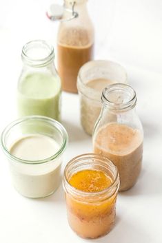 several jars filled with different types of food