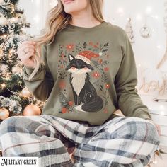 Introducing our christmas fox sweatshirt- an enchanting blend of botanical beauty and christmas charm! This artistic illustration features a fox surrounded by lush plants and flowers capturing the essence of Winter in a whimsical and natural setting. A classic sweatshirt with crew neck Pre-shrunk. 1x1 athletic rib-knit collar with spandex Air-jet spun yarn with a soft feel and reduced pilling. Double-needle stitched collar, shoulders, armholes, cuffs, and hem Quarter-turned to avoid crease down the middle. This product is made on demand. Botanical Christmas, Artistic Illustration, Lush Plants, Art Sweater, Botanical Beauty, Plants And Flowers, Christmas Charms, Christmas Art, Rib Knit