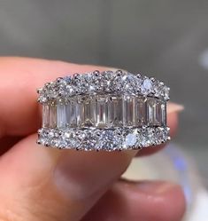 Looking for an anniversary band that has a fashionista in mind, but that manages to be classy at the same time? Then we think that we have the perfect diamond ring for you. This 2.68ct t.w. baguette and round diamond ring combine round and baguette-shaped stones. Its classic style adds lots of sparkle to any girl's finger. And what is great is that you can wear this as an anniversary ring, or simply as a fabulous accessory.Metal: 18K White GoldDiamond Weight: 2.68ct t.w.Band Width At It's Center Round Cut Diamond Ring, Diamond Dress Ring, Be Classy, Real Diamond Rings, Diamond Anniversary Bands, Round Diamond Ring, Dress Rings, Engagement Ring Styles, Pretty Rings