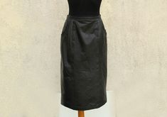 Vintage black Leather Skirt / 90's black Leather Skirt / High Waisted Leather Skirt / Fully Lined  Label Size: 38 Measurements (lying flat): Waist: 13.5" / 34.2 cm Hips: 19 3/4" / 50.1 cm Length: 28" / 71.1 cm Condition: great vintage (please PAY ATTENTION  to image No. 7) Material: genuine leather N.B. Color may slightly differ from picture SHIPPING * I ship worldwide via Priority mail (Latvijas Pasts) from Latvia (EU). * I ship from Europe, so please allow 2 to 4 weeks for the package to arrive if you live overseas. * Europe 5 - 10 business days. VB High Waisted Leather Skirt, Black Leather Skirt, Black Leather Skirts, Priority Mail, Vintage Black, Leather Skirt, Favorite Outfit, Womens Skirt, Genuine Leather