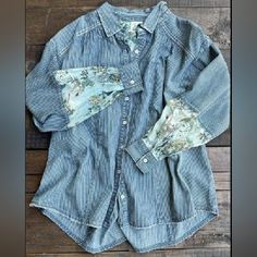 Denim Feel With Floral Fabric Inserts, Is A Beautiful Cottagecore Button Up. The Stripes Are Reminiscent Of Ticking In Grandma's Feather Bed! Fading Details And Distressing Throughout, Create A Lived In Look. One Size Bust 26" Length 28" By Jaded Gypsy Spring Washed Button-up Blouse, Spring Chambray Shirt With Buttons, Washed Blue Cotton Top With Button Cuffs, Spring Chambray Button-up Blouse, Spring Washed Blue Tops With Button Cuffs, Spring Denim Top, Pre-washed, Spring Denim Tops Pre-washed, Relaxed Fit Denim Blouse With Buttons, Spring Washed Blue Shirt With Buttons