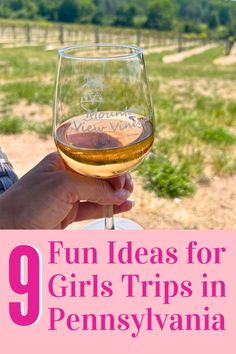 a person holding a wine glass with the words fun ideas for girls trips in pennsylvania