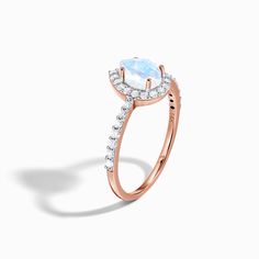 About This Ring
Cherish your love with our elegant Moonstone Ring With Diamonds - Tear of Joy, an iridescent, genuine grade AAA Moon Magic Rainbow Moonstone surrounded by a sea of 29 authentic Diamonds. The perfect piece to remember this moment, forever.    
Details
- Solid 14kt Rose Gold (weight: approx. 1.91 grams)- 29 conflict free Diamonds (weight: 0.33 Ct)  // Color: I // Clarity Rating : VS-2- Genuine & iridescent Rainbow Moonstone (Grade AAA)- Band Width: 1mm- Celestial White Moonstone Ring With Halo, Celestial Style White Moonstone Ring With Halo, Celestial Moon Shaped Ring With Halo, Celestial Moon Ring With Halo, Celestial Moon Shaped Rings With Halo, Celestial Moon-shaped Rings With Halo, Mystical Halo Ring For Promise, Ethereal Halo Rings For Promise, Ethereal Halo Rings For Promises