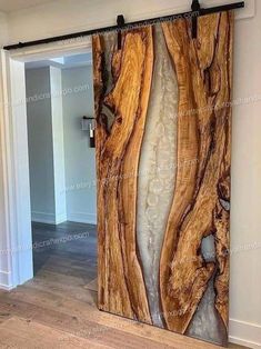 the door is made out of wood and has glass panels that look like waves on it