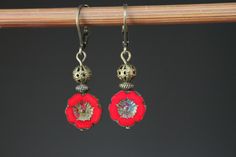 Red Earrings Czech Glass Earrings Flower Earrings Dangle Earrings Drop Earrings Gift For Her Gift for women Color : 12mm red Picasso Hawaii Flower Beads, Opaque, Czech Glass Beads, Hibiscus, Pansey Finish : Antiqued brass findings Size : 1,5 inches including the antiqued brass lever back Ear wires : Antiqued brass lever back Available in green, turquoise, navy blue, yellow, orange, purple and red: https://www.etsy.com/listing/744363663/blue-earrings-flower-earrings-dangle?ref=shop_home_active_27 Adjustable Red Flower Earrings With Ear Wire, Elegant Red Flower Earrings With Ear Wire, Red Flower Earrings As Gift, Red Flower Earrings For Gift, Red Flower Earrings With Ear Wire, Red Nickel Free Drop Flower Earrings, Red Flower Shaped Earrings With Ear Wire, Red Round Flower Earrings With Ear Wire, Red Dangle Earrings With Lever Back Ear Wires