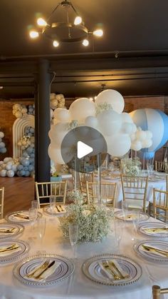 a table set up with balloons and place settings