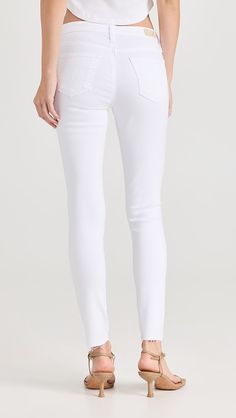 AG Legging Ankle Jeans | Shopbop White High Rise Stretch Cropped Jeans, White Stretch High Rise Cropped Jeans, High Rise Jeans With Pockets In Elastane, High Rise Jeans With Pockets, Fitted Pants With Frayed Hem And Cropped Leg, Fitted Cropped Pants With Frayed Hem, Stretch Jeggings With Five Pockets For Work, Stretch Jeggings For Workwear, Fitted Tapered Leg Bottoms With Frayed Hem