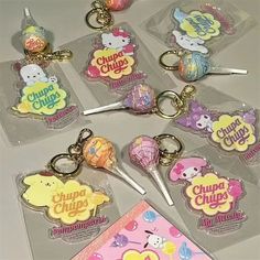 several key chains with different designs on them