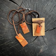 Natural Stone Pendant Necklace paired with native Texas Pecan wood. All natural, hand polished and shaped materials sourced for West Texas river stones and salvaged wood. As unique and beautiful as Texas. Each river stone and wood pairing is hung from deerskin leather and finished with a sterling silver lobster clasp. Preserve a part of Texas when you purchase our products. A wearable a bit of Texas' history to fit every occasion. Earthy Brown Waxed Cord Necklaces, Brown Pendant Jewelry For Everyday Use, Earthy Brown Waxed Cord Necklace, Everyday Use Brown Pendant Jewelry, Adjustable Natural Wood Necklace Nature-inspired, Adjustable Wood Jewelry Nature-inspired, Adjustable Wood Jewelry In Nature-inspired Style, Adjustable Artisan Natural Wood Necklace, Artisan Brown Jewelry With Adjustable Cord