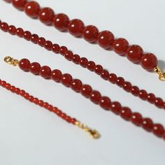 Embrace the spirit of the New Year with our Red Agate Stone Beaded Necklaces. Each piece is a harmonious blend of luxurious gold plating and the vibrant energy of Red Agate stones. Product Highlights: Variety of Sizes: Choose from the selection of Red Agate stones in 4mm, 6mm, 8mm, and 10mm sizes. This variety allows you to personalize your style and create a dynamic look. Adjustable Length: The necklace's adjustable inner circumference ensures a perfect fit for every neckline, making it a versa Red Agate Necklace, Energy Protection, Stone Necklaces, Geometric Type, Stone Beaded Necklace, Vibrant Energy, Agate Necklace, Red Agate, Swarovski Pearls