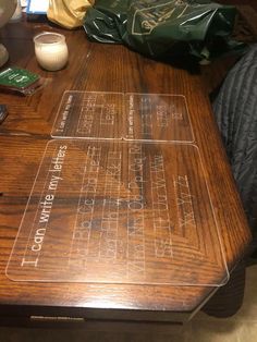 a wooden table with some writing on it