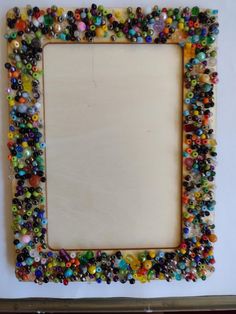 a frame made out of glass beads and wood